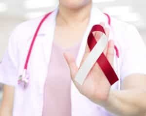 Female,Doctor,In,White,Uniform,With,Red,And,White,Ribbon